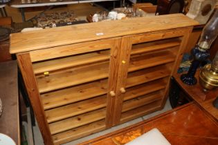 A pine glazed hanging cabinet