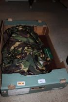 A box of various camouflage clothing