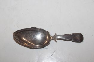 A Georgian silver caddy spoon with simple engraved decoration, Hallmarked London 1812, maker