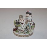 A Dresden porcelain figure depicting two children