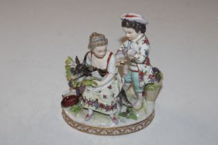 A Dresden porcelain figure depicting two children