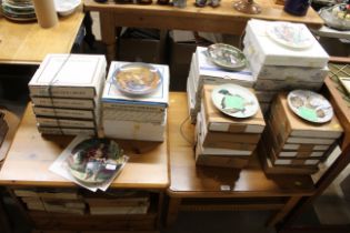 A large collection of collector's plates to includ