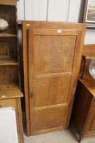 An oak single door cupboard