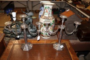 A pair of plated three light candelabra, 36cm high