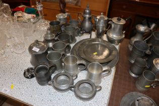 A collection of antique and later pewter plates, tankards etc.