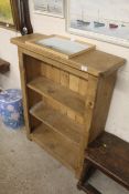 A pine open fronted bookcase