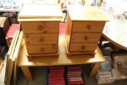 A pair of pine bedside chests fitted three drawers