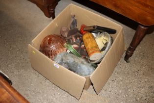 A box containing various items to include pottery