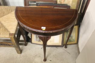 A mahogany demi-lune hall table