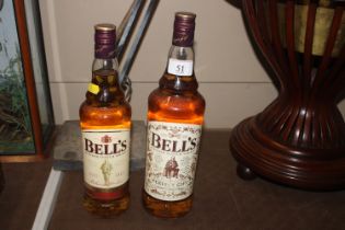 A 1L bottle of Bells scotch whisky and a 70cl bott