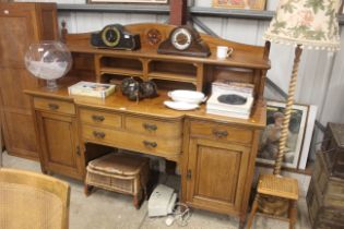 An Edwardian mahogany sideboard fitted two short o