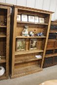 A pine open fronted bookcase with four adjustable