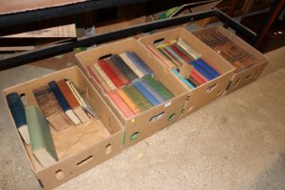 Four boxes of various books to include leather bou