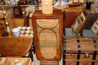 An Art Deco cabinet, interior fitted two glass she