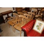 A set of six beech dining chairs comprising two ca