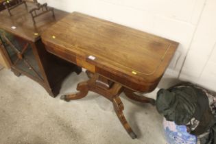 A Regency rosewood and brass inlaid card table