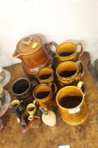 An Arthur Wood tea pot and various tankards