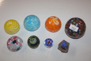 Eight various glass paperweights