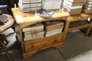 A pine tv stand fitted single drawer