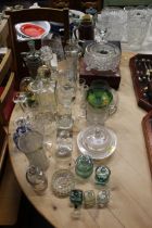 A collection of various table glassware to include