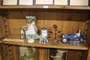 A quantity of various sundry items to include doorstop, novelty racing car figure, thermometer etc.