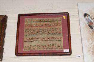 A Victorian sampler in mahogany frame