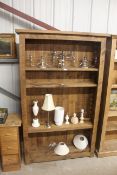 A pine open fronted bookcase with five adjustable