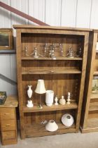 A pine open fronted bookcase with five adjustable