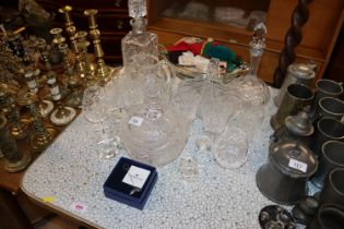 A pair of cut glass crystal decanters; various oth