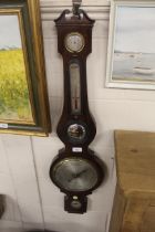 A Victorian rosewood banjo shaped wheel barometer