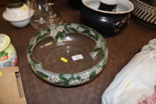 A clear glass bowl with painted decoration of flow