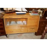 A G-plan sideboard with drop down flap compartment