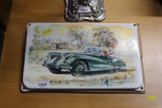 A Jaguar SK120 enamelled plaque