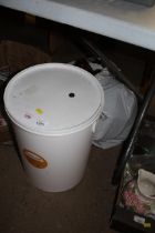 A beer fermentation bucket and a quantity of plast