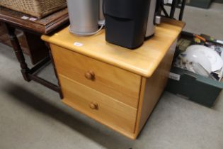 A beech two drawer bedside chest