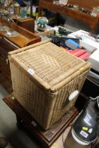 A wicker laundry basket