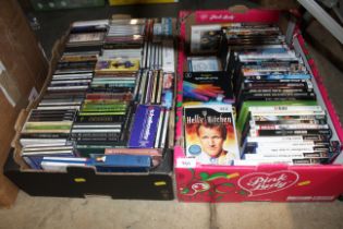 Two boxes containing CDs and computer games