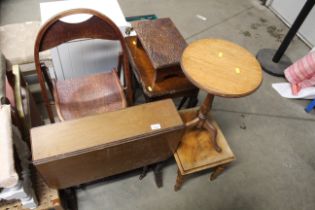 A folding chair, a nest of three occasional tables,