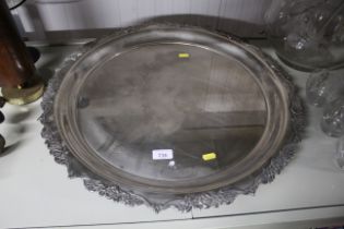 A large circular silver plated tray