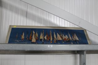 A framed print 'Boats at Night'