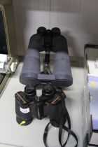 A pair of Prinz 10x50 binoculars and a pair of Sun