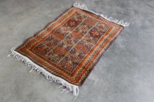 An approx. 4'8" x 3' patterned rug