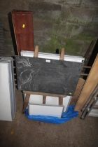 A child's chalk board on easel, three white boards