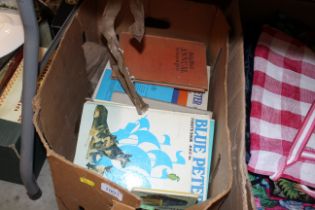 A box of books and Blue Peter annuals