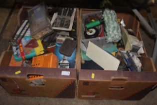 Two boxes containing various items including cork