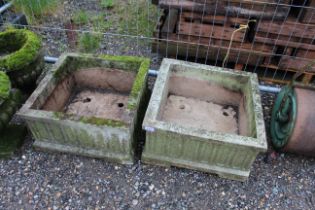 Two low square concrete planters