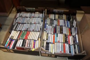 Two boxes of various cassette tapes