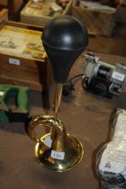 A brass taxi horn (88)