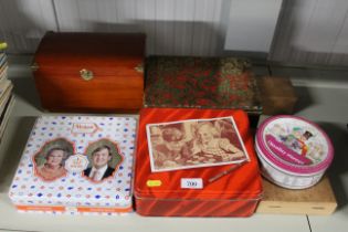 A collection of wooden boxes and advertising tins