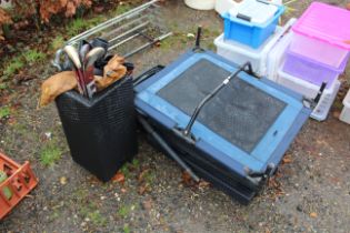 A rattan style stick stand containing three hockey